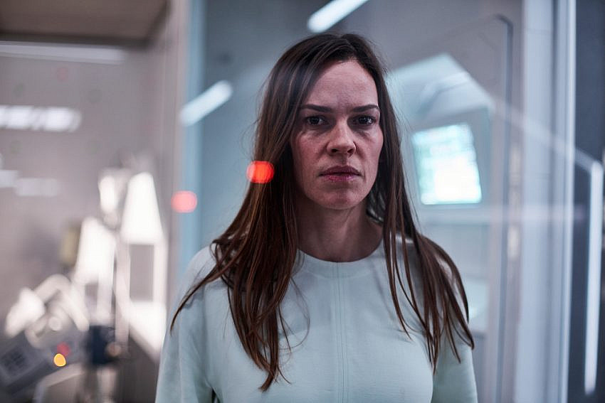 Hilary Swank as “Woman” in Infirmary looking through window in I Am Mother.