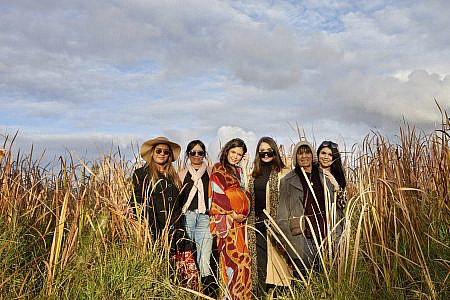 Kelly, Daniella, Shenika, Aleisha, Nan Doreen and Sharna Rules posing in a grassy field