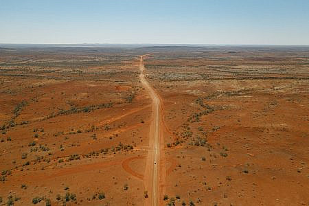 Road cutting through vast outback